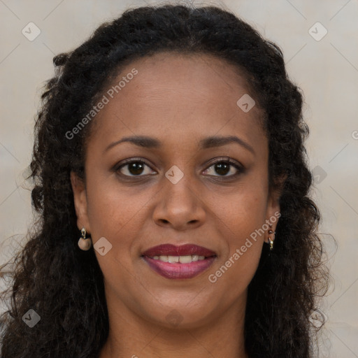 Joyful black young-adult female with long  brown hair and brown eyes