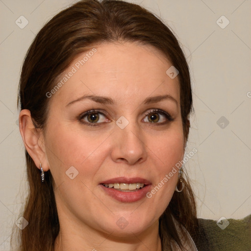 Joyful white adult female with long  brown hair and brown eyes