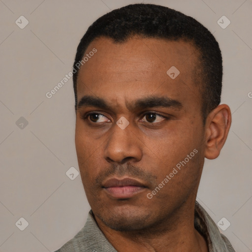 Neutral latino young-adult male with short  black hair and brown eyes