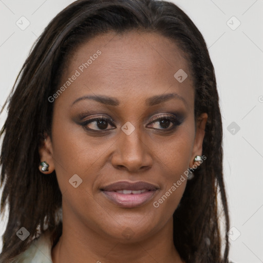 Joyful black young-adult female with long  brown hair and brown eyes