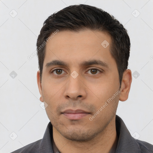 Neutral latino young-adult male with short  black hair and brown eyes