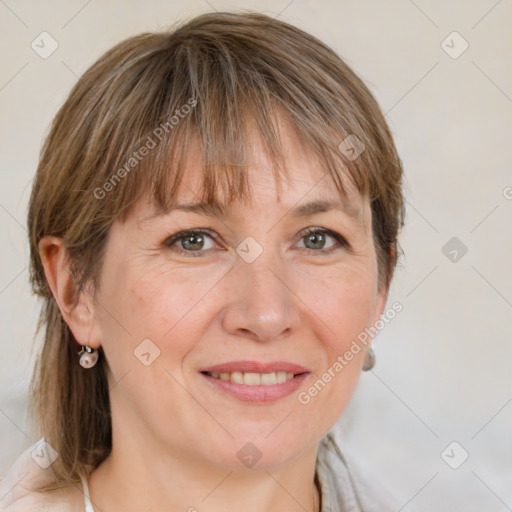 Joyful white adult female with medium  brown hair and grey eyes