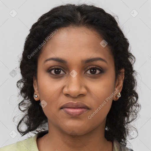 Joyful black young-adult female with long  brown hair and brown eyes