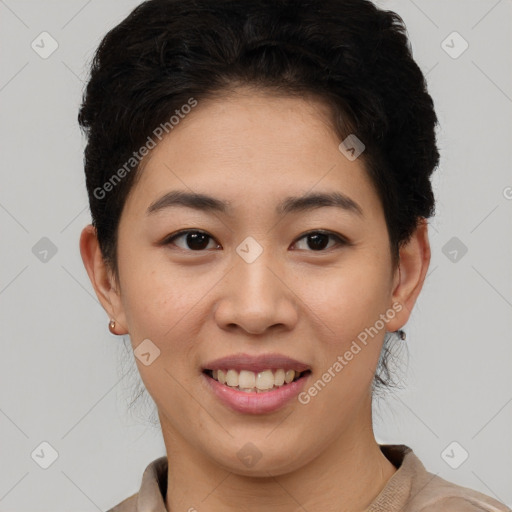 Joyful asian young-adult female with short  brown hair and brown eyes