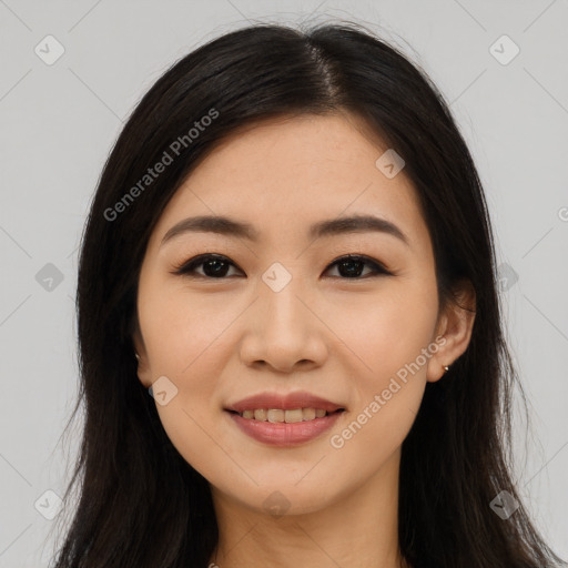 Joyful latino young-adult female with long  brown hair and brown eyes