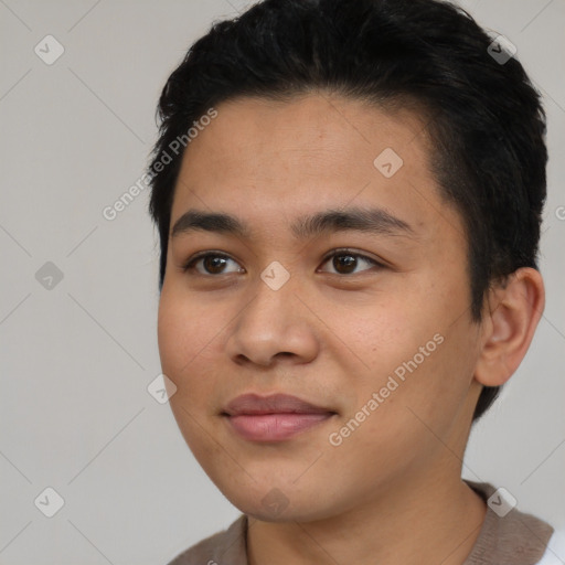 Joyful asian young-adult male with short  black hair and brown eyes