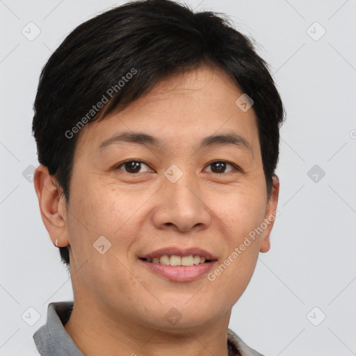 Joyful asian young-adult male with short  brown hair and brown eyes