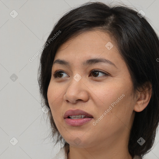 Joyful white adult female with medium  brown hair and brown eyes