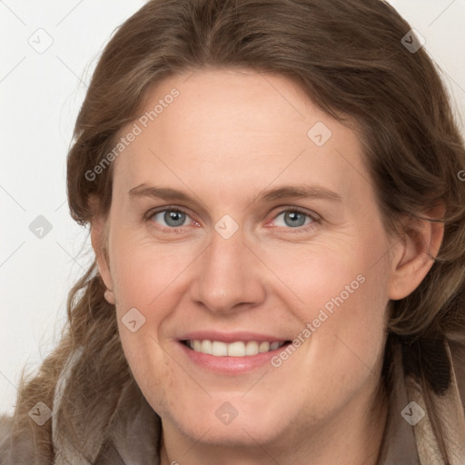 Joyful white young-adult female with long  brown hair and grey eyes