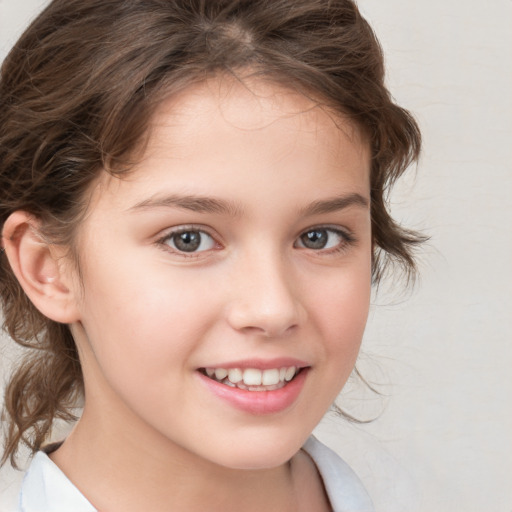 Joyful white child female with medium  brown hair and brown eyes