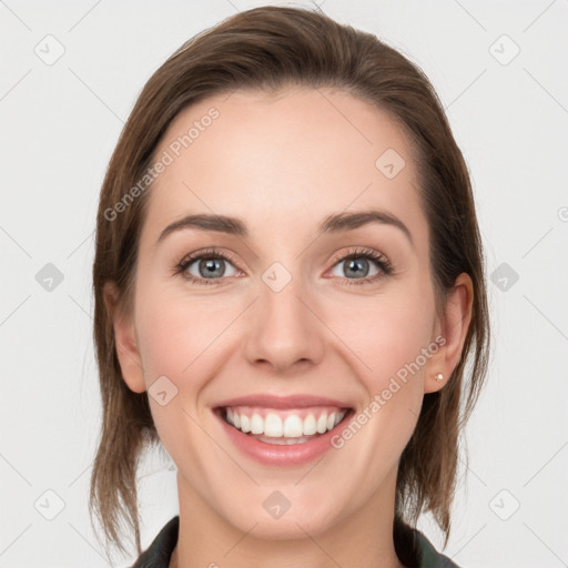 Joyful white young-adult female with medium  brown hair and blue eyes