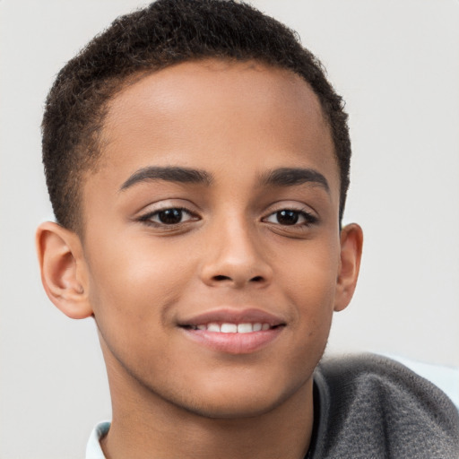 Joyful white child male with short  brown hair and brown eyes