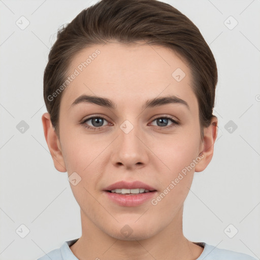 Joyful white young-adult female with short  brown hair and grey eyes