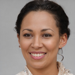 Joyful black young-adult female with medium  brown hair and brown eyes