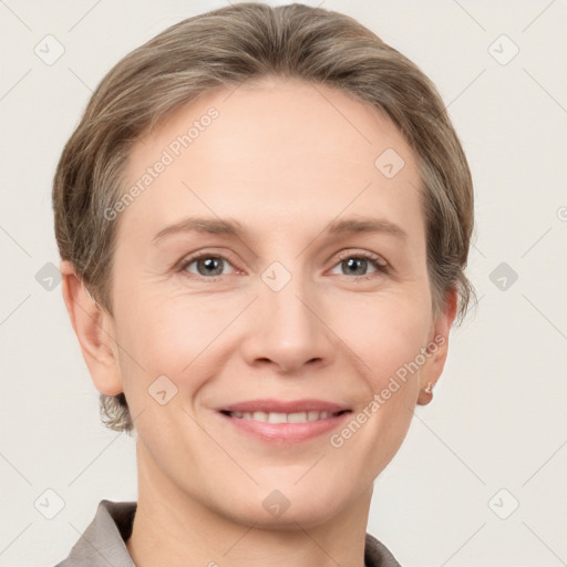 Joyful white adult female with short  brown hair and grey eyes