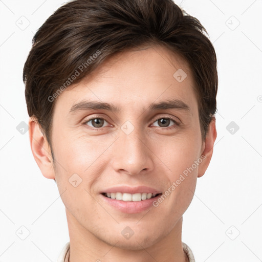 Joyful white young-adult male with short  brown hair and grey eyes