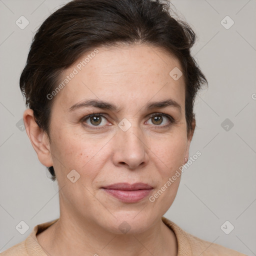 Joyful white adult female with short  brown hair and grey eyes