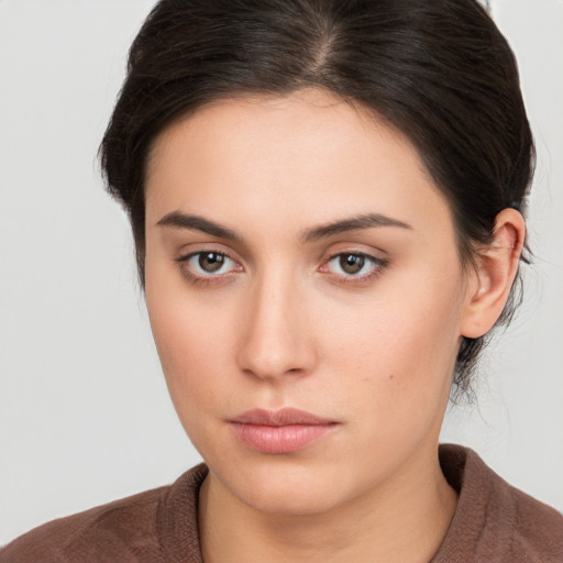 Neutral white young-adult female with medium  brown hair and brown eyes