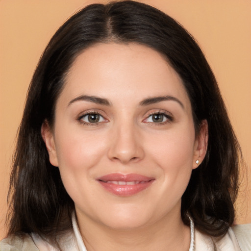 Joyful white young-adult female with medium  brown hair and brown eyes