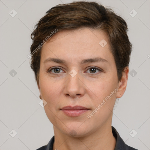 Joyful white adult female with short  brown hair and brown eyes