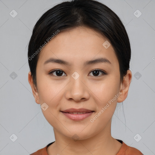 Joyful latino young-adult female with short  black hair and brown eyes