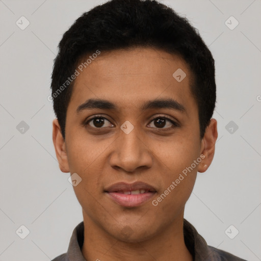 Joyful latino young-adult male with short  black hair and brown eyes