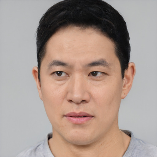 Neutral asian young-adult male with short  black hair and brown eyes