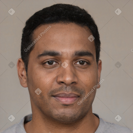 Joyful black young-adult male with short  brown hair and brown eyes