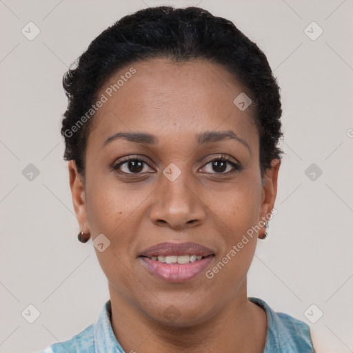 Joyful black adult female with short  black hair and brown eyes