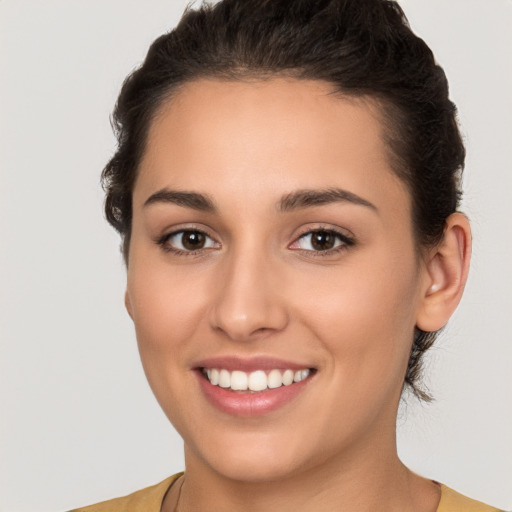 Joyful white young-adult female with short  brown hair and brown eyes