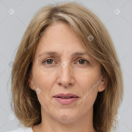 Joyful white adult female with medium  brown hair and grey eyes