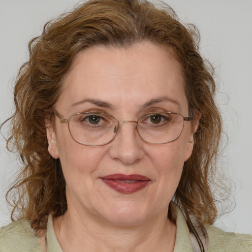 Joyful white middle-aged female with medium  brown hair and brown eyes