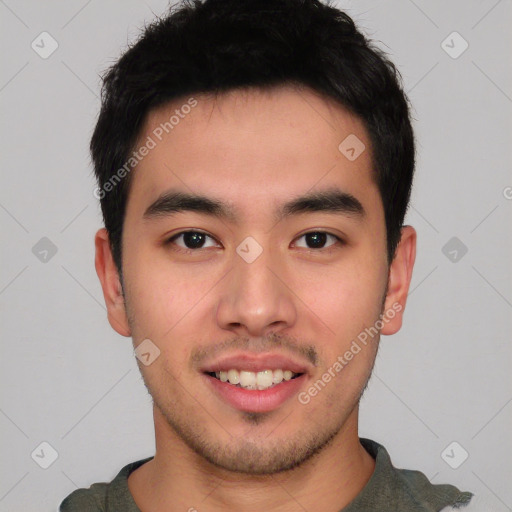 Joyful asian young-adult male with short  black hair and brown eyes