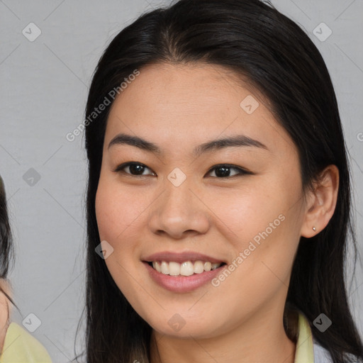 Joyful latino young-adult female with medium  brown hair and brown eyes