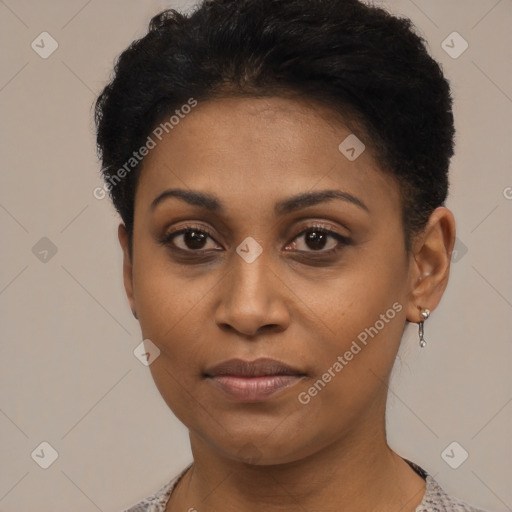 Joyful latino young-adult female with short  black hair and brown eyes