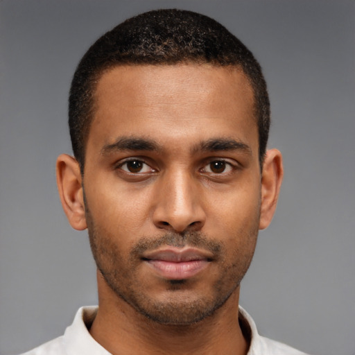 Neutral black young-adult male with short  black hair and brown eyes