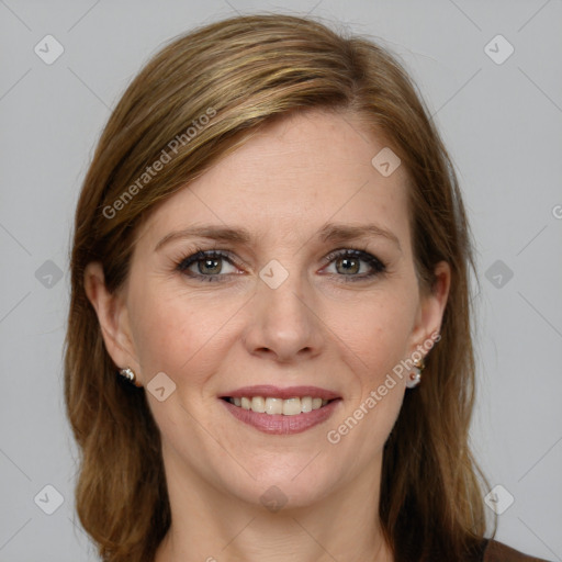 Joyful white adult female with medium  brown hair and blue eyes