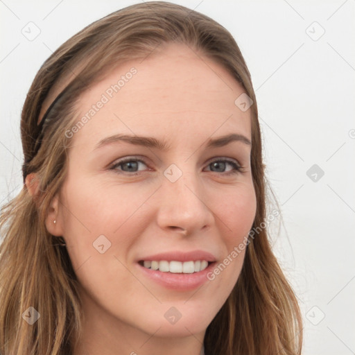 Joyful white young-adult female with long  brown hair and blue eyes