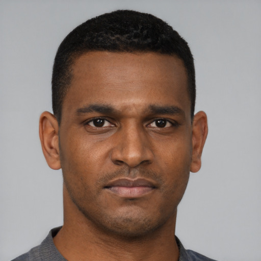 Neutral black young-adult male with short  black hair and brown eyes