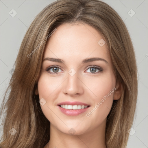 Joyful white young-adult female with long  brown hair and green eyes