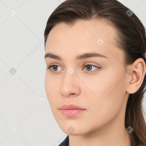 Neutral white young-adult female with long  brown hair and brown eyes