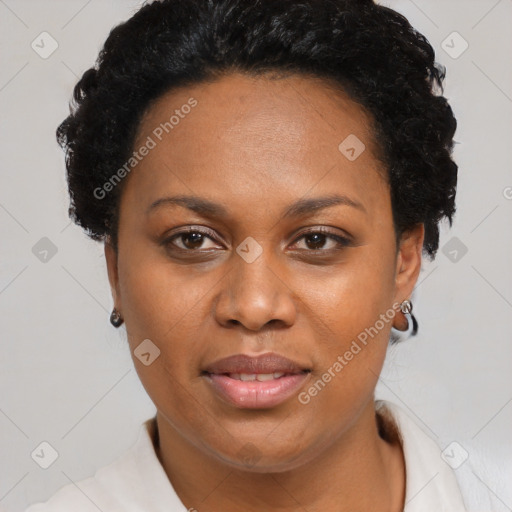 Joyful black adult female with short  brown hair and brown eyes