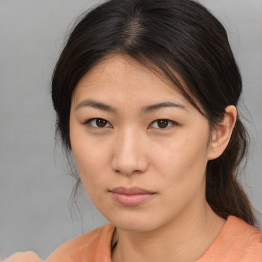Neutral asian young-adult female with medium  brown hair and brown eyes
