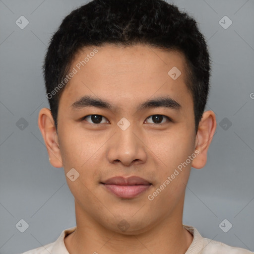 Joyful latino young-adult male with short  brown hair and brown eyes