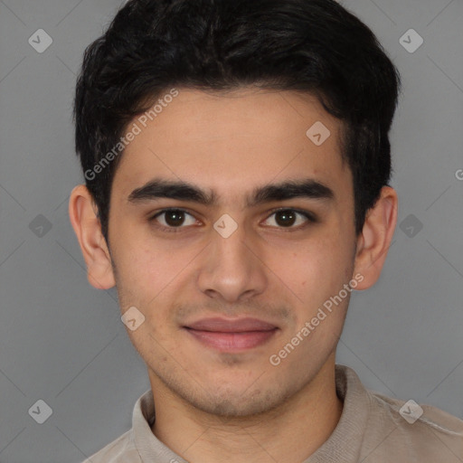 Joyful latino young-adult male with short  brown hair and brown eyes