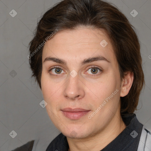 Joyful white adult female with medium  brown hair and brown eyes