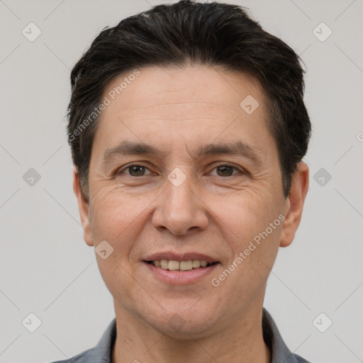 Joyful white adult male with short  brown hair and brown eyes