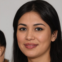 Joyful latino young-adult female with long  black hair and brown eyes