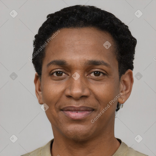 Joyful black adult male with short  black hair and brown eyes