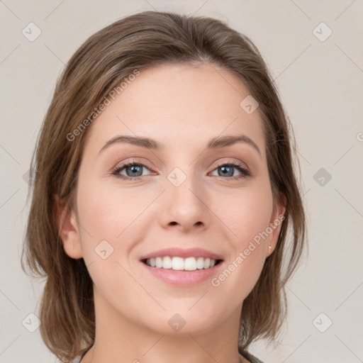 Joyful white young-adult female with medium  brown hair and green eyes